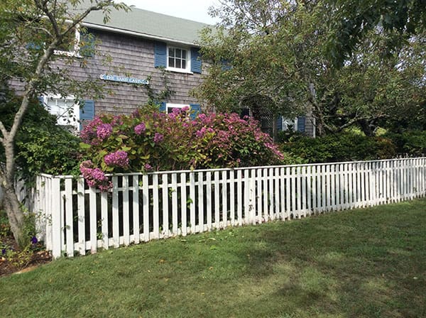 Nantucket House in front of the white fence